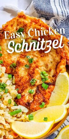 an easy chicken schnitzel with rice and lemon wedges on a plate