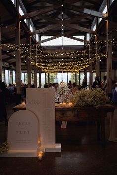 the reception tables are set up with candles