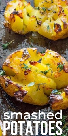 baked potatoes with herbs on top and the words smashed potatoes above it in white lettering