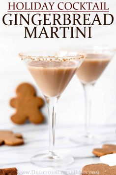 two glasses filled with gingerbread martinis on top of a white table next to cookies