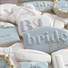 some cookies that have been decorated to look like bride and groom's names on them