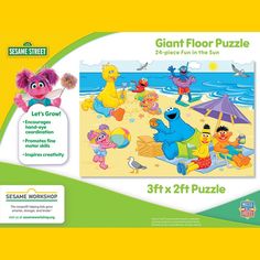 the sesame street giant floor puzzle is shown in front of an advertisement for sesame street