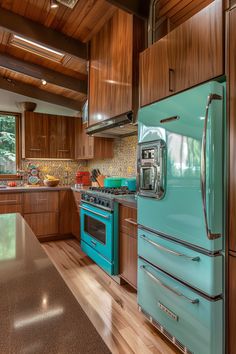 a kitchen with blue appliances and wooden cabinets in the center, along with wood flooring