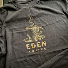 a long sleeved shirt with the word eden coffee on it