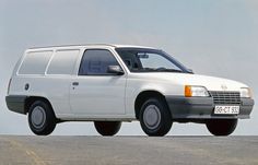 a white van parked on top of a parking lot