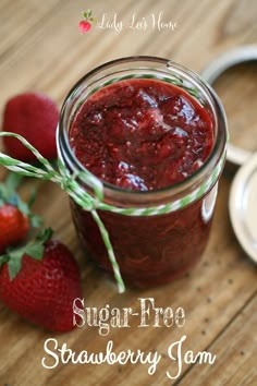 strawberry jam in a mason jar with strawberries on the side and text overlay that reads sugar - free strawberry jam