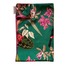 a green and pink flowered scarf on a white background with an image of a bird in flight