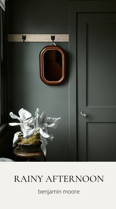 a room with green walls and white flowers