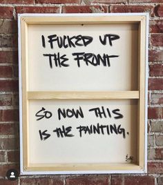 two wooden frames with graffiti on them against a brick wall that says, i fund up the front so now this is the painting