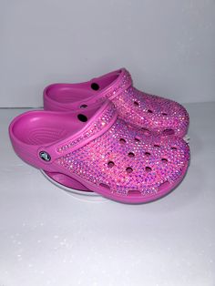 Bright Pink Custom Crocs for adults, bedazzled in pink glass rhinestones.  Classic or Baya style crocs are used, unless specified in notes which you want, order will be made with style available but color and stones will still match video.  Each rhinestone is hand placed on the crocs. Processing time is 1-2 weeks   They can be hand washed and scrubbed. Handle with care and do not leave in direct sunlight or extreme heat.  There are no refunds or exchanges as each items is fully inspected before Bedazzled Crocs, Bling Crocs, Styling Crocs, Custom Crocs, Crocs Pink, Pink Crocs, Sneakers Athletic, Extreme Heat, Cute Everyday Outfits