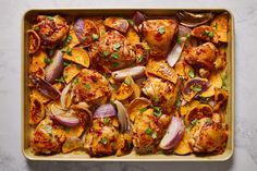 chicken and potatoes in a casserole dish with herbs