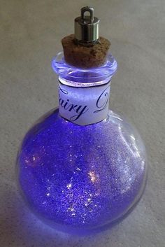 a purple bottle with a cork on top