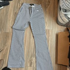 Brand New Never Worn. Size 7/27 Flare Pinstripe Denim Trendy High Waist Pinstripe Bottoms, Casual High Waist Pinstripe Pants, High Waist Pinstripe Cotton Bottoms, Striped Straight Leg Denim Jeans, Striped Straight Leg Cotton Jeans, Trendy Cotton Jeans With Vertical Stripes, Trendy Cotton Bottoms With Vertical Stripes, Trendy High Waist Striped Pants, Trendy High-waist Striped Pants