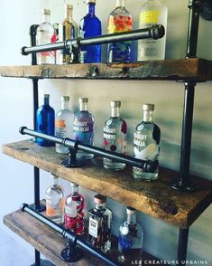 an industrial style shelf with bottles on it