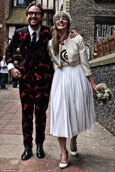 a man and woman dressed up in costumes