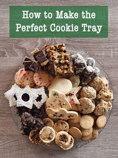 a glass plate filled with cookies and treats on top of a wooden table next to a green sign that says how to make the perfect cookie tray