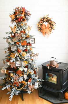 a decorated christmas tree in front of a tv