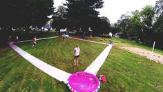 people playing frisbee in the park on a cloudy day with no one around