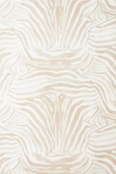 an animal print wallpaper with white and beige stripes