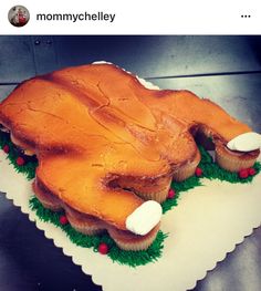 a cake shaped like a turkey sitting on top of a table