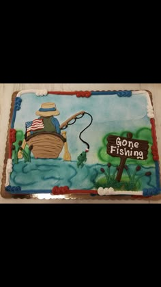 a cake that is decorated to look like a fishing boat and the words gone fishing on it