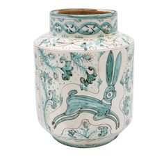 a blue and white vase with an image of a rabbit in the center on it