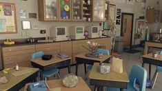 an empty classroom with desks and chairs