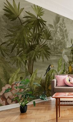 a living room filled with furniture and wallpaper covered in tropical plants on the walls