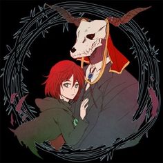 two anime characters are hugging in front of an animal skull and demon's head