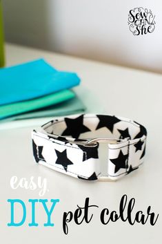 an easy diy pet collar made with black and white stars on it, sitting on a table