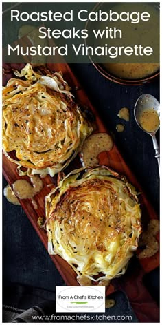 roasted cabbage steaks with mustard and vinaigrete on a wooden cutting board