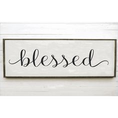 a wooden sign that says,'blessed'in black ink on a white background