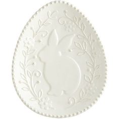 a white plate with an ornate design on the front and side, set against a white background