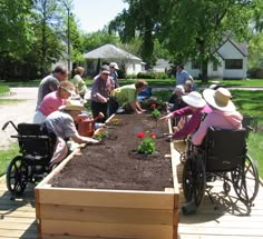 many people are working in the garden together