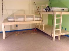 two bunk beds with ladders and toys on the floor