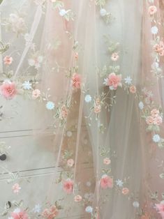 pink and white flowers on sheer tulle