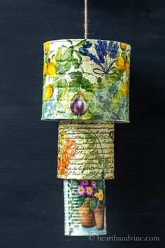 a lamp hanging from a rope with flowers on it