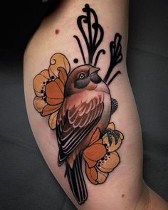 a bird with flowers on its leg