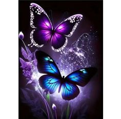 two purple butterflies flying over some flowers