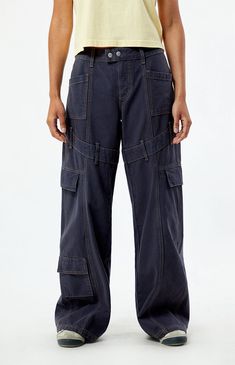 Step into street-style confidence with the Navy Low Rise Baggy Cargo Pants from PacSun. These pants feature a low-rise waist, contrast stitching throughout for added flair, belt loop details around the thigh, and cargo and patch pockets for utility. With their relaxed baggy fit, they offer both comfort and a bold, streetwear-inspired look for any casual outing.Model is wearing a size 26Model measurements: 5’7” height, 32” bust, 24” waist, 35” hip PacSun Womens Navy Low Rise Baggy Cargo Pants - Blue size 26 Utility Pants Outfit Street Style, Navy Cargo Pants Outfit, Low Rise Baggy Cargo Pants, Utility Pants Outfit, Cargo Pants Aesthetic, Baggy Pants Outfit, Navy Cargo Pants, Baggy Cargo Pants, Cargo Pants Outfit