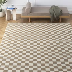 a brown and white checkered area rug in a living room with a bench, potted plant and bookshelf