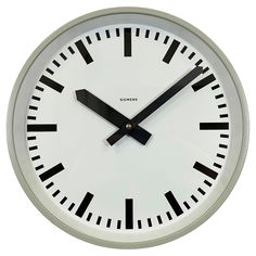 an analog clock with roman numerals is shown on a white background and reads inducca