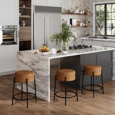 a kitchen with marble counter tops and stools