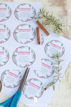 the printable christmas pot stickers are next to some scissors and cinnamon sticks on top of paper