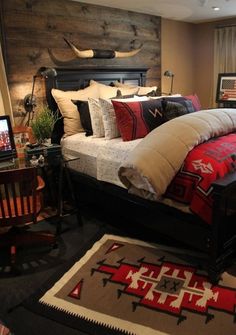 a bed room with a neatly made bed next to a desk and television on top of it