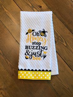 a white towel with the words oh honey stop buzzing and busy bee on it