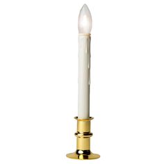 a candle that is on top of a gold plated stand with a white candle