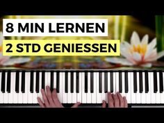 someone is playing the piano with their hands and fingers on it, while they are in front of a flower