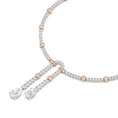 The Linked Tennis Necklace combines classic style with contemporary sophistication. The interspersed station diamonds create an engaging visual texture, adding depth and allure to this already stunning piece.With a generous total diamond weight of 14 carats, this necklace is a treasure trove of radiant beauty. Every diamond is hand-selected for its exceptional quality, ensuring that you shine with an unparalleled brilliance. Classic Diamond Necklace, Radiant Beauty, Infinity Pendant, Visual Texture, India Jewelry, Tennis Necklace, Fancy Color Diamonds, Diamond Set, Gold Platinum