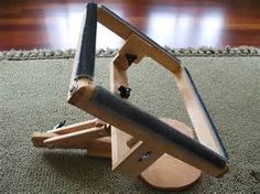 a small wooden chair sitting on top of a carpeted floor next to a rug